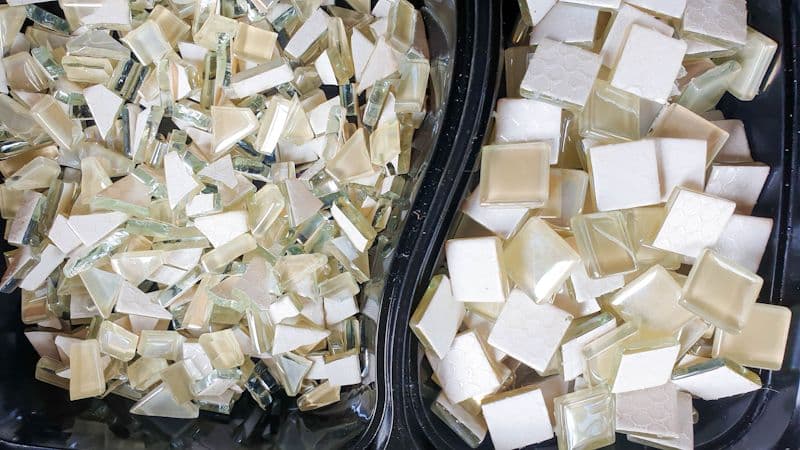 Small square mosaic tiles cut into random shapes