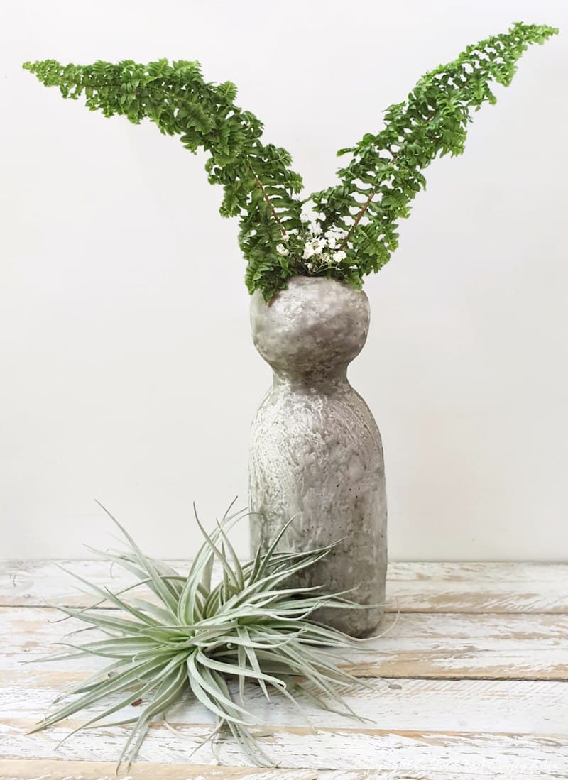 Make a delightful faux concrete bunny vase in under an hour using stuff you probably have lying around. This easy Easter craft is perfect for adding a touch of rustic elegance to your home decor. Use it to display long leaves for bunny ears or fill it with flowers for a beautiful centerpiece. It's a fun and creative way to welcome spring.