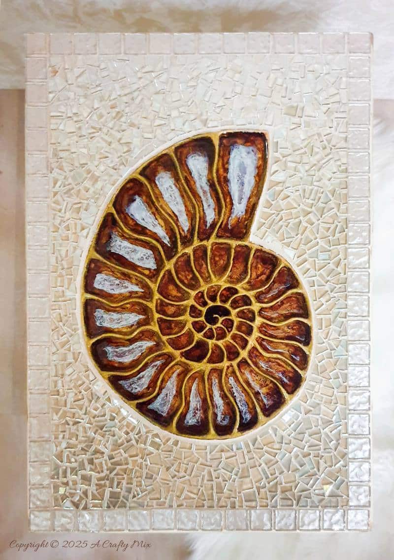 Looking for a unique way to breathe new life into an old piece of furniture? We&rsquo;ll show you how we gave a water-damaged tabletop a gorgeous &ldquo;mosaic and ammonite inlay&rdquo; makeover. This comprehensive guide provides detailed, easy-to-follow steps (with loads of photos) that will help you create your own masterpiece from start to finish. And you don&rsquo;t need any fancy materials to pull this one off either.