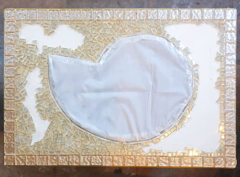 When doing a mosaic, I prefer working from the outside inwards.