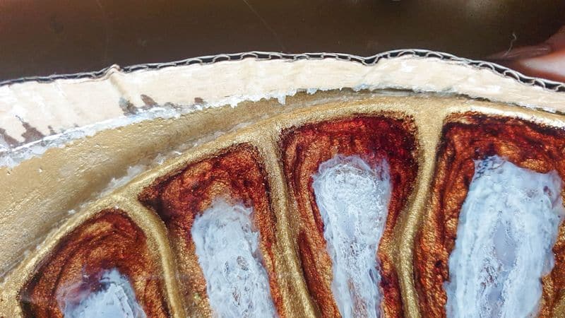 Remove the cardboard border once the resin has cured