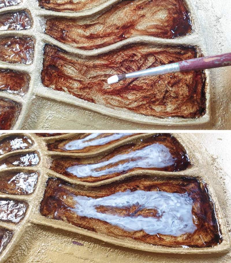 Use craft paint on top of the resin for extra dimension