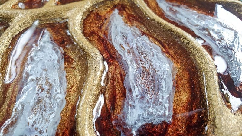 The addition of alcohol ink forms small cells in the resin.