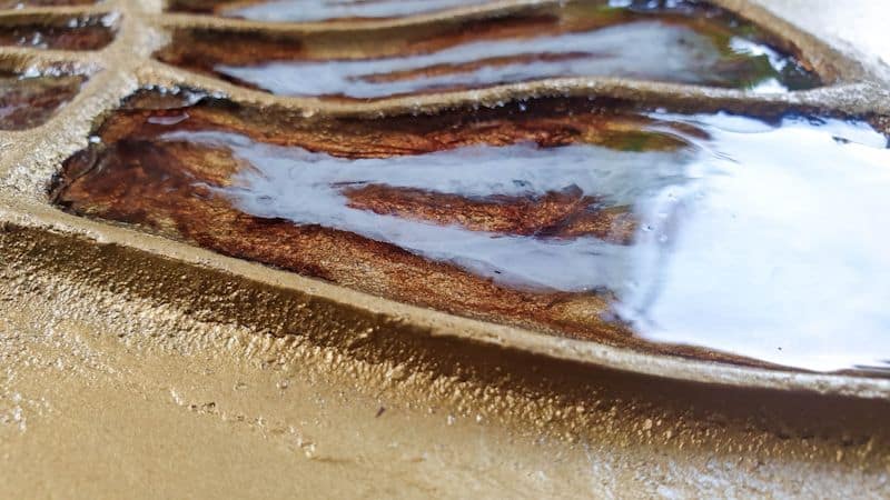 Add a final resin layer to level the tabletop out.