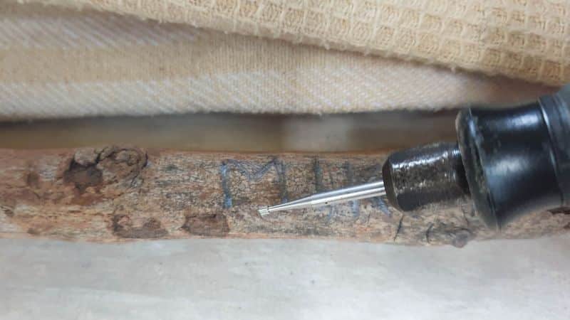 Hand-carve your name into the branch. You can also use a Dremel