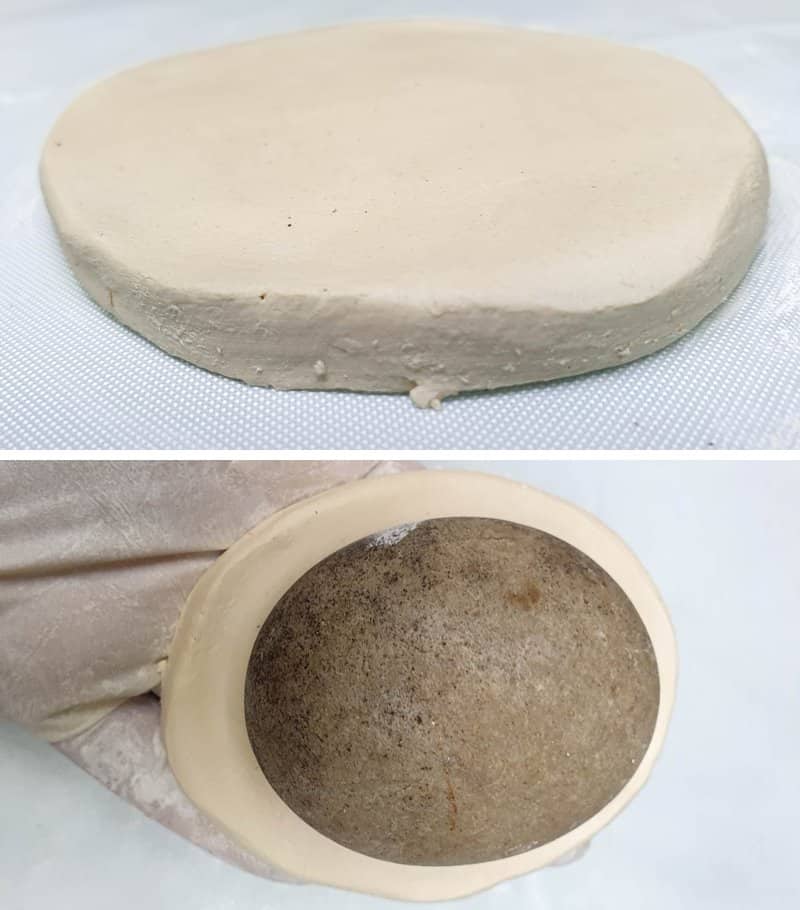 Use a pebble to form the clay spoon