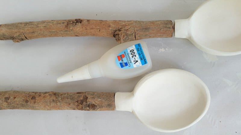 Glue the branch handles onto the clay spoons