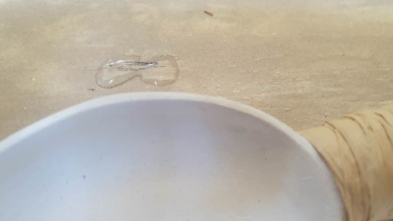 Glue the spoons onto the canvas