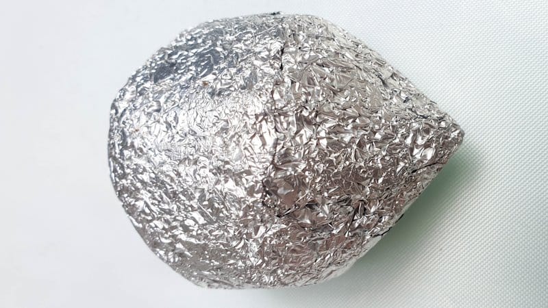A top view of the tin foil hedgehog body before adding clay