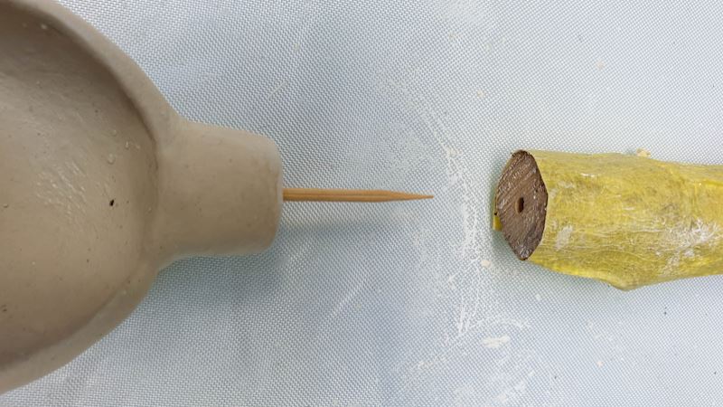 Insert a toothpick into the spoon. It makes it easier to connect to the handle