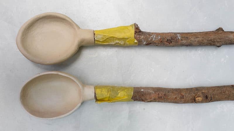 Two clay spoons before baking.