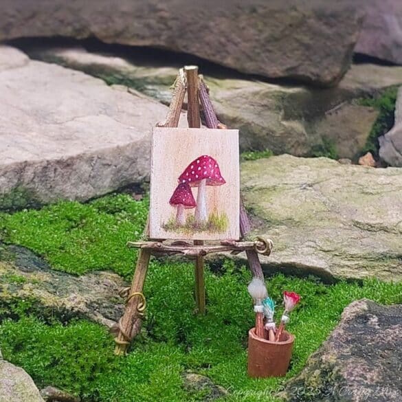 Make your own fairy easel and mini paintbrushes with this step-by-step tutorial. These charming little crafts are quick, easy and perfect for fairy gardens, dollhouse displays, or showcasing miniature art.