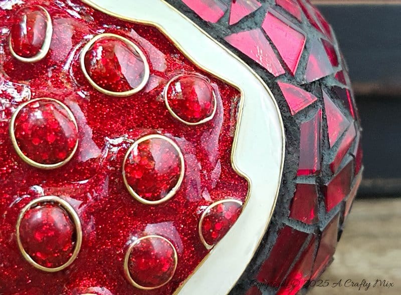 Love mosaics and want to try something new? This faux cloisonn&eacute; pomegranate combines bold mosaic tiles with glistening, wire-framed seeds for a show-stopping effect. No kiln needed&mdash;just creativity and a few craft supplies. Pin for your next DIY art adventure. 