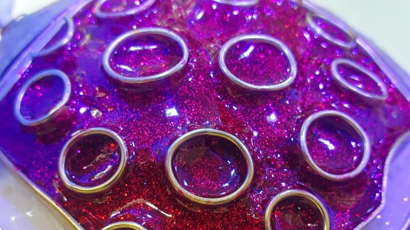 Cure the nail polish filled seeds under a UV light