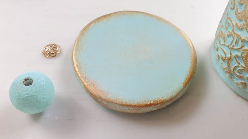 Paint the lid to match the embossed container