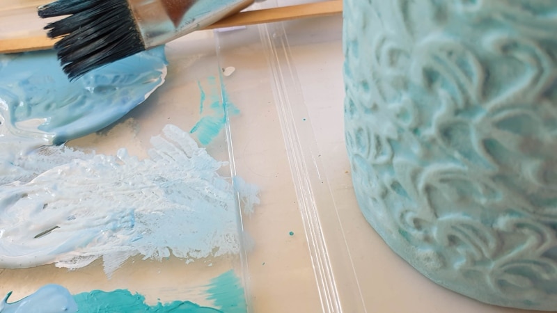 Paint the clay-covered Pringles can to suit your decor.