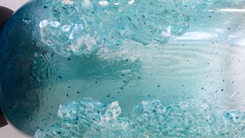 Take your time to glue the shattered glass on the glass vase