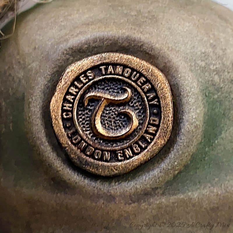 Upcycle ordinary bottles into old world treasures with this easy DIY. This beginner-friendly tutorial teaches you how to create an authentic antique clay finish using simple powdered food coloring and texture paste. Perfect for rustic or old-world d&eacute;cor.