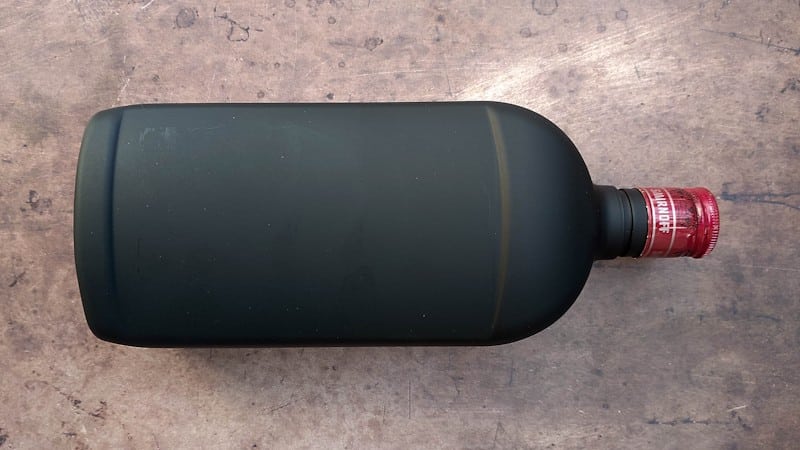 Remove the label and paint the plastic bottle black