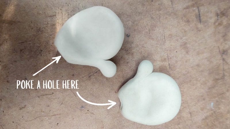 Two clay hands before they cure. I poked a hole in the bottom for the arms