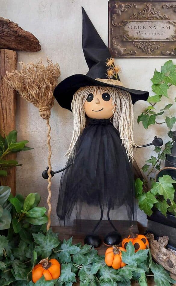 Turn a recycled plastic bottle into a cute gothic witch with mop hair and a tulle dress. This fun DIY tutorial is perfect for Halloween decor and easy enough for crafters of any level. Add a touch of handmade magic to your spooky season with this adorable upcycled project.