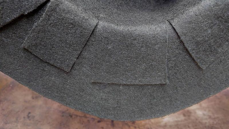 A view of the bottom of the witch's hat showing how the slits have been glued down