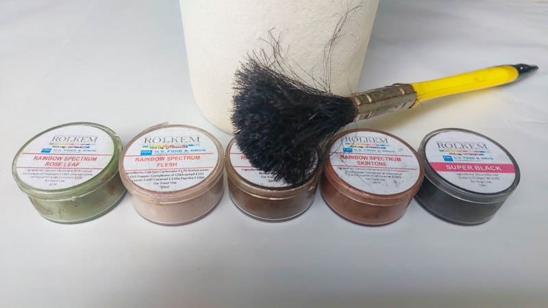 I used earthy toned powder food coloring to age a glass bottle