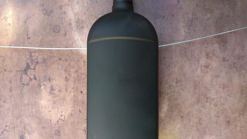 Thread the arm wire through the holes on the side of the bottle