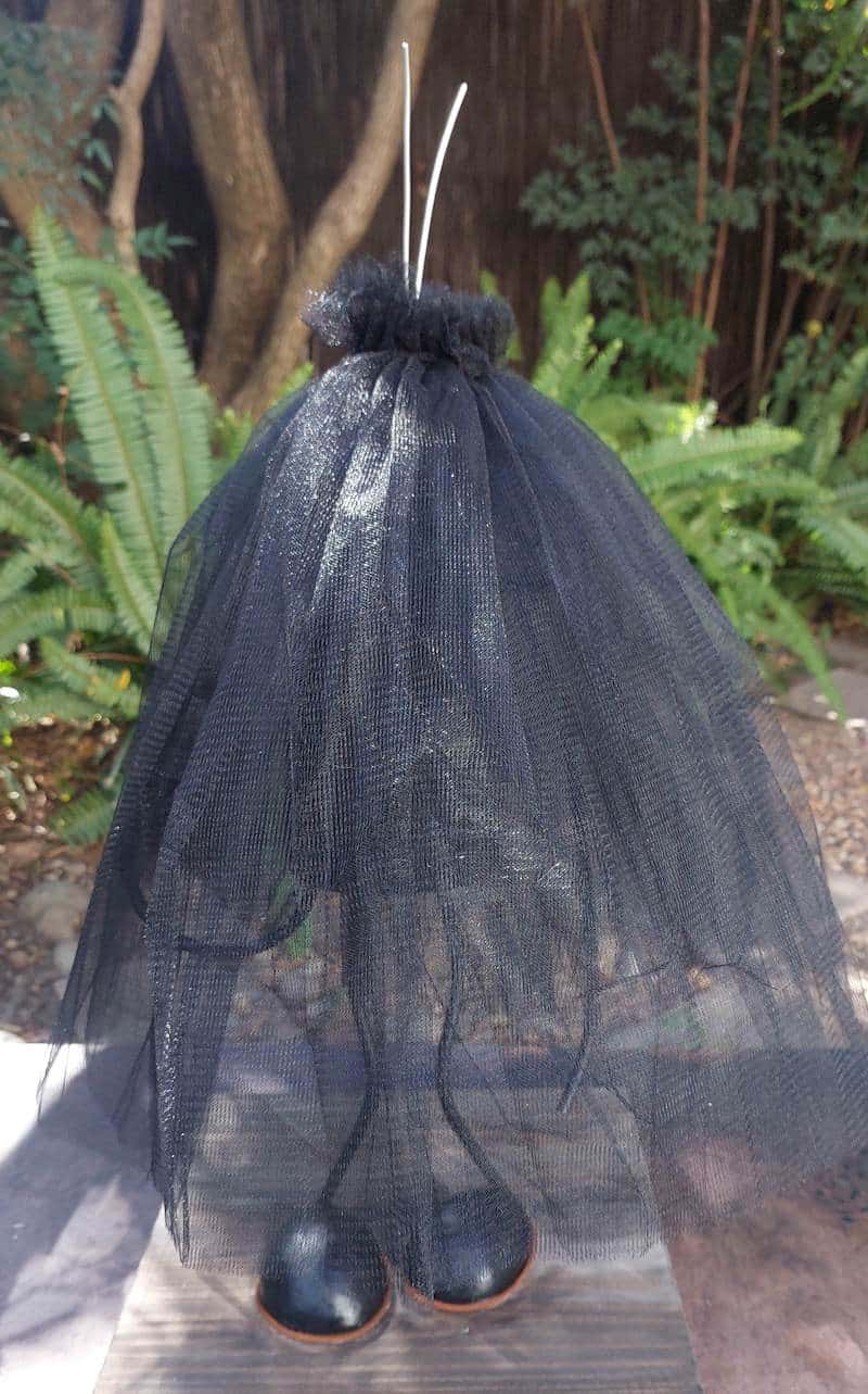 Turn a recycled plastic bottle into a cute gothic witch with mop hair and a tulle dress. This fun DIY tutorial is perfect for Halloween decor and easy enough for crafters of any level. Add a touch of handmade magic to your spooky season with this adorable upcycled project.