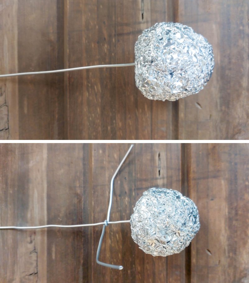 Stick the foil ball on to a piece of wire and add arms