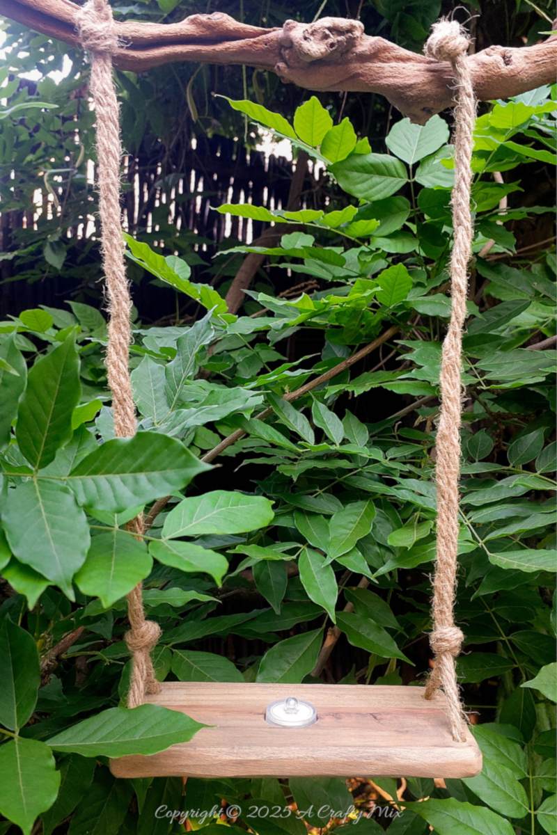 Hang the ghost swing from a branch or hooks in the ceiling