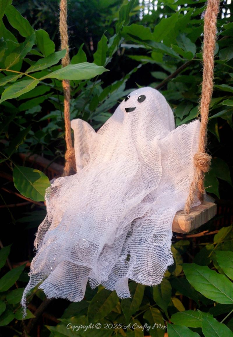 Add a pinch of playful fright to your Halloween with easy to make ghost on a swing—hang it indoors or out so he can welcome trick-or-treaters with his cheeky grin. Perfect for adding a magical, kid-friendly twist to any festive space.
