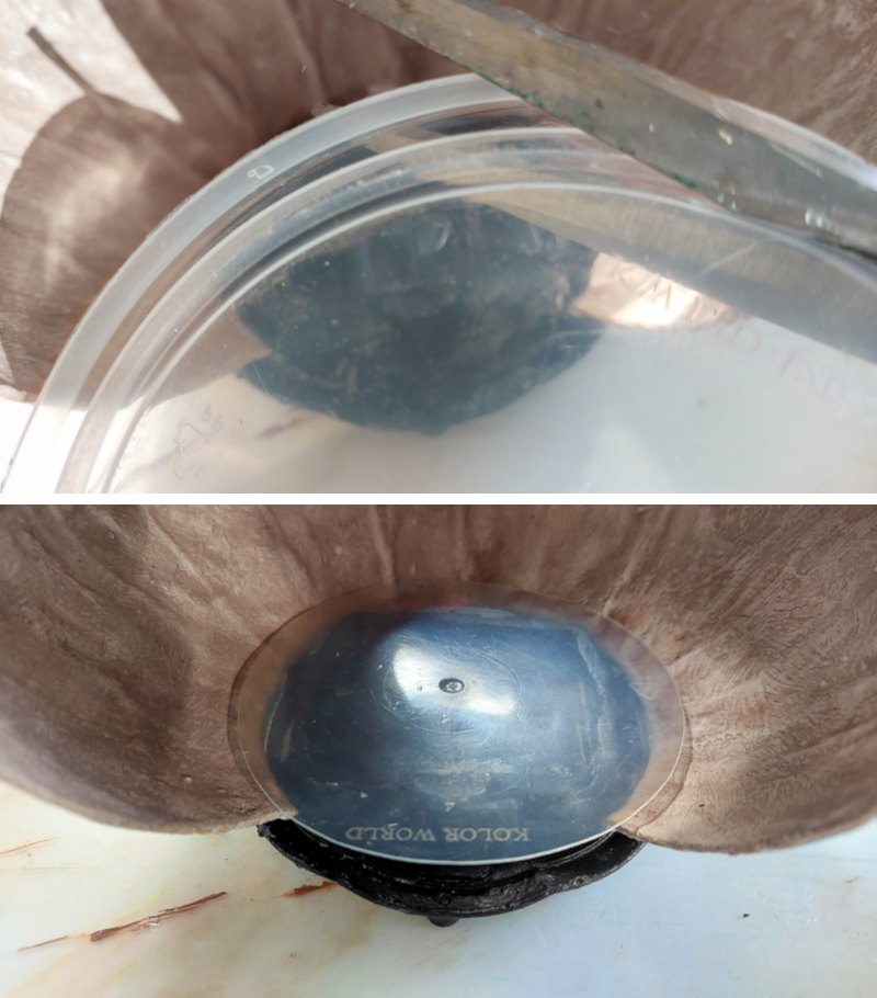 Trim a plastic lid to make a floor for the art studio
