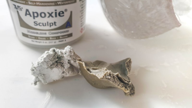 Mix equal quantities of the epoxy clay to make the cladding for the window frame