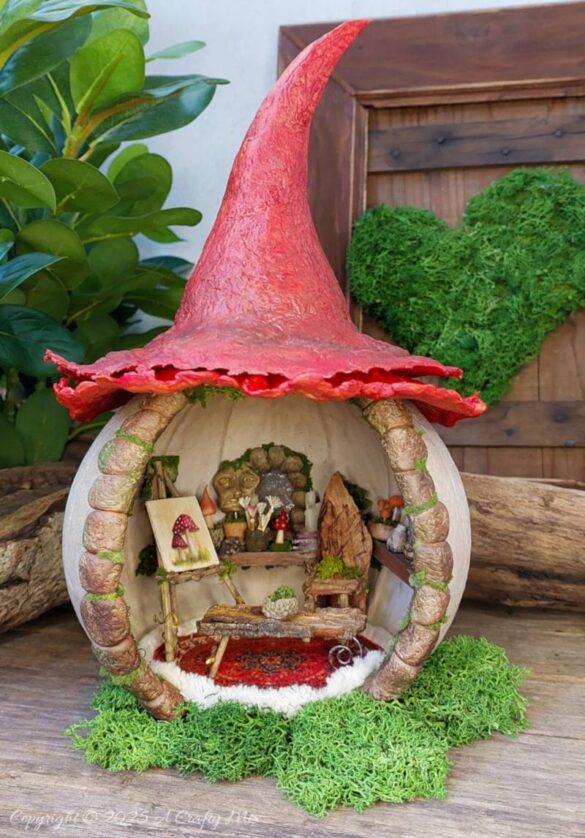 Transform an ordinary plastic pumpkin bucket into a magical fairy artist’s studio, complete with a mushroom-capped roof, miniature easel, and enchanting woodland details. Perfect for upcycling fans and fairy garden lovers looking to add a whimsical touch to their creative craft projects.