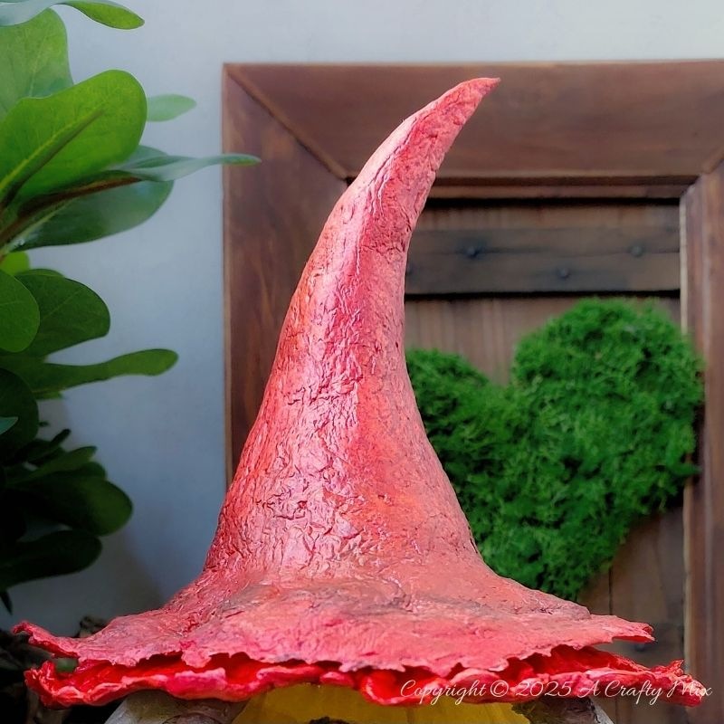 Transform an ordinary plastic pumpkin bucket into a magical fairy artist&rsquo;s studio, complete with a mushroom-capped roof, miniature easel, and enchanting woodland details. Perfect for upcycling fans and fairy garden lovers looking to add a whimsical touch to their creative craft projects.