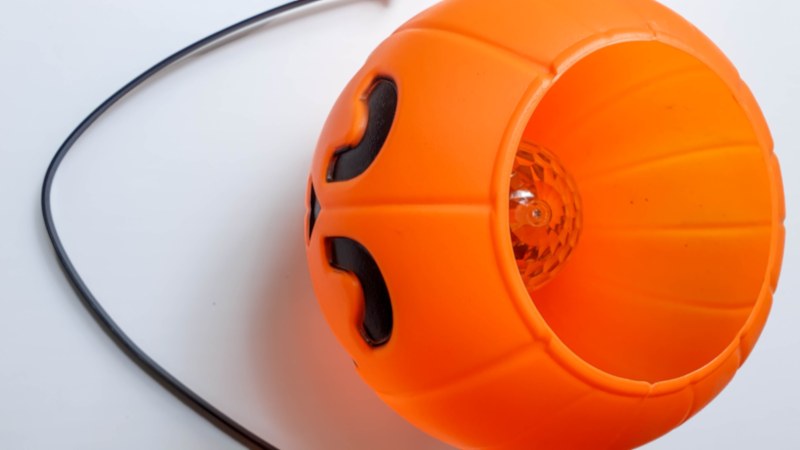 Remove the handle from the plastic pumpkin