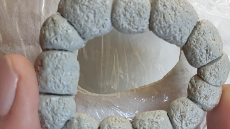 Once the clay dries, remove the stone window frame