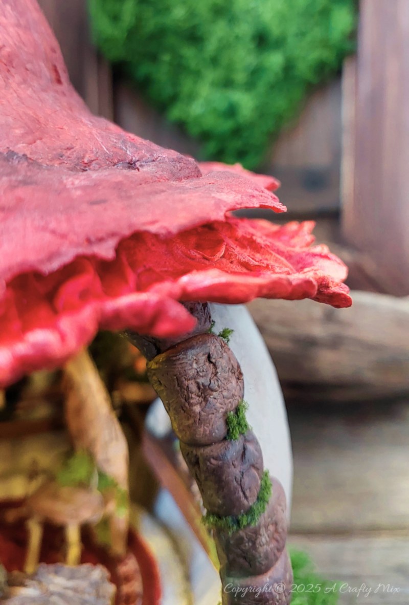 Transform an ordinary plastic pumpkin bucket into a magical fairy artist&rsquo;s studio, complete with a mushroom-capped roof, miniature easel, and enchanting woodland details. Perfect for upcycling fans and fairy garden lovers looking to add a whimsical touch to their creative craft projects.