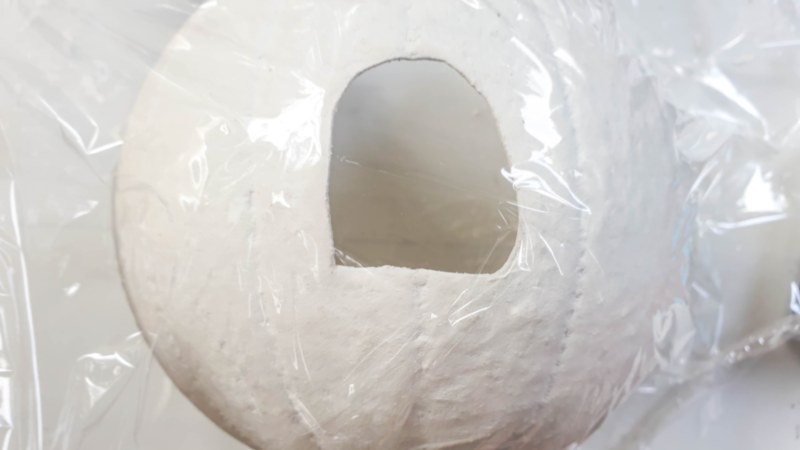 Wrap the plastic pumpkin in cling film before adding the clay windows