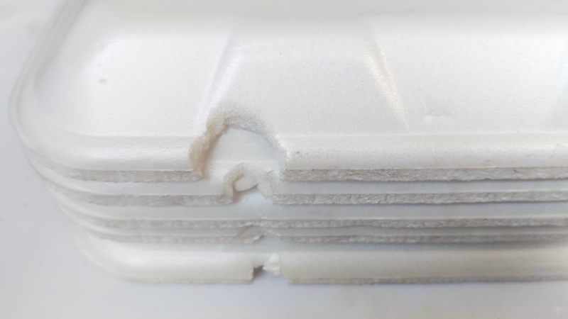 A close up view of the damaged polystyrene (styrofoam) takeaway dishes