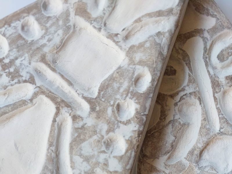 A close up view of the Faux Bali whitewashed carvings on the trees