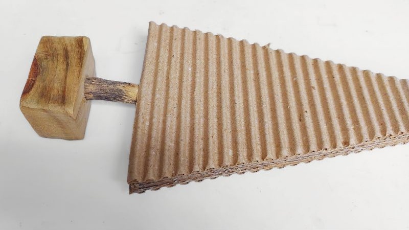 Glue on a twig tree trunk and use a scrap piece of wood to make a stand