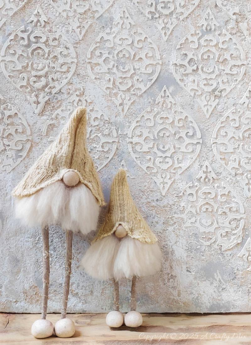 Love hygge style and handmade d&eacute;cor? Save this easy upcycled DIY&mdash;old socks, wire coat hangers, and craft scraps become the cutest long-legged Scandinavian gnomes for your shelf, mantel, or festive display.