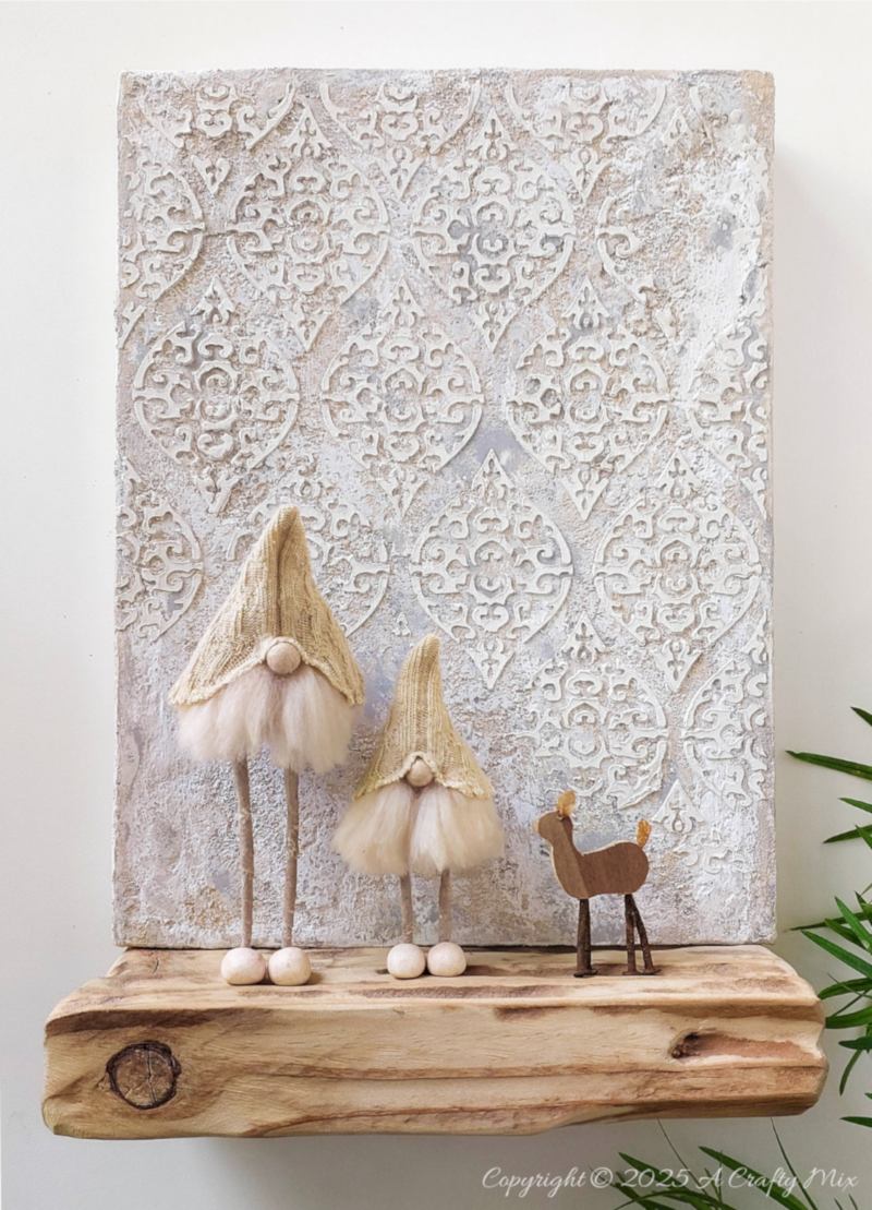 Love hygge style and handmade d&eacute;cor? Save this easy upcycled DIY&mdash;old socks, wire coat hangers, and craft scraps become the cutest long-legged Scandinavian gnomes for your shelf, mantel, or festive display.