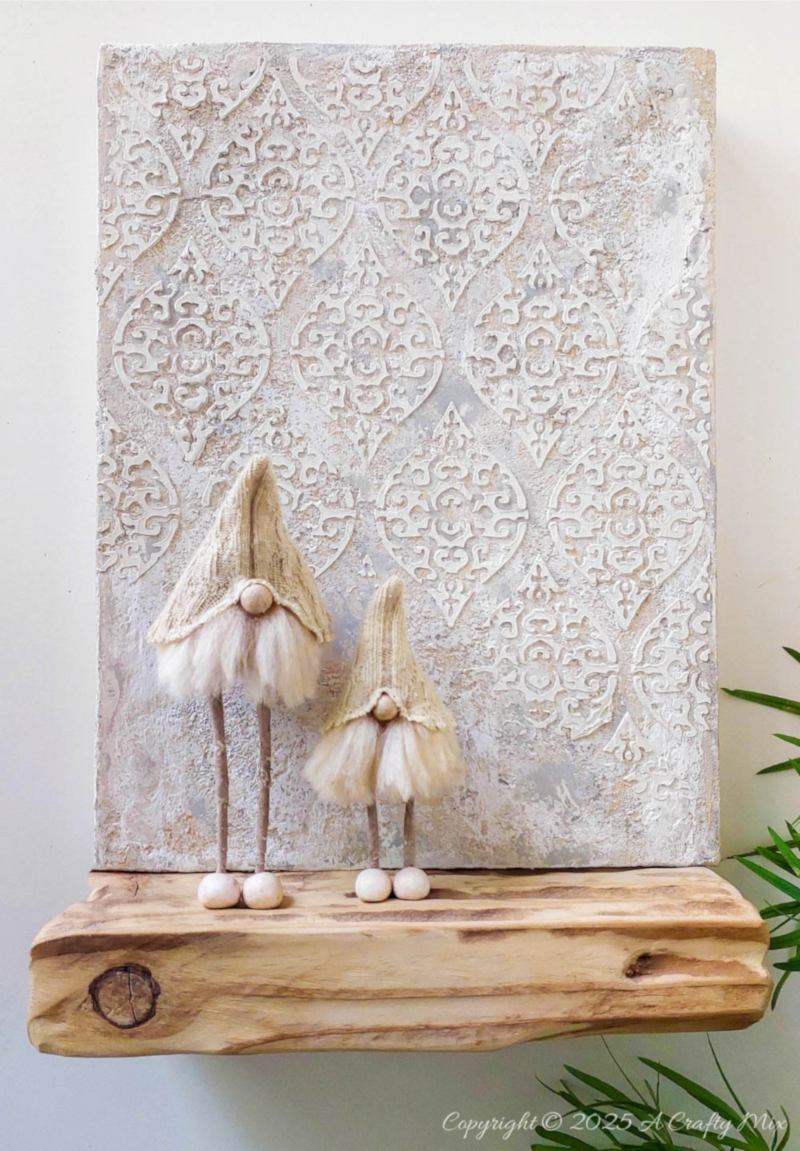 Love hygge style and handmade d&eacute;cor? Save this easy upcycled DIY&mdash;old socks, wire coat hangers, and craft scraps become the cutest long-legged Scandinavian gnomes for your shelf, mantel, or festive display.