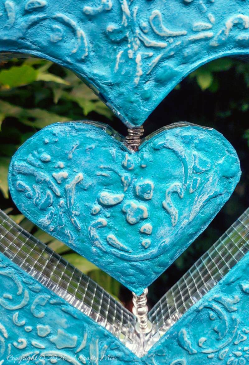 If you love upcycling, this cardboard heart wind spinner project shows how to turn leftover boxes into a unique hanging decoration that catches the light and creates fairy-like reflections everywhere.