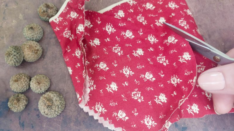 Cut a circle out that's roughly 3 or 4 times the size of the acorn caps