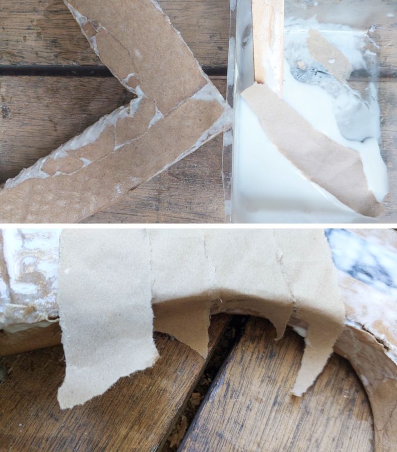 Glue on strips of paper to seal and protect the cardboard