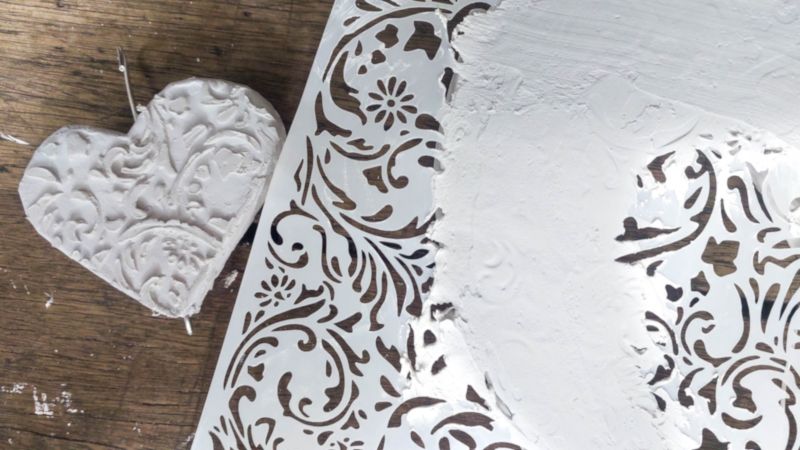 Adding a 3D stencil to the cardboard hearts